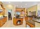 Spacious kitchen with large island, granite countertops, and ample storage at 1515 Sunset Pointe Pl, Kissimmee, FL 34744