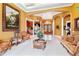 Elegant living room boasts ornate furniture and a view into the entryway at 1515 Sunset Pointe Pl, Kissimmee, FL 34744