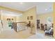 Upstairs hall with seating area and views to the lower level at 1515 Sunset Pointe Pl, Kissimmee, FL 34744