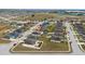 Aerial view of a home in a residential area at 1606 Steely Dr, Dundee, FL 33838