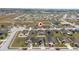 Aerial view of house and surrounding neighborhood at 1606 Steely Dr, Dundee, FL 33838