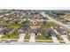 Aerial view of a single-Gathering home in a residential neighborhood at 1606 Steely Dr, Dundee, FL 33838