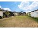 Spacious backyard with pool and covered patio at 1606 Steely Dr, Dundee, FL 33838