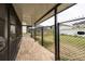 Covered patio with brick pavers and fenced backyard at 1606 Steely Dr, Dundee, FL 33838