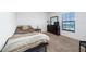 Bedroom with a twin-size bed and carpeted floor at 1606 Steely Dr, Dundee, FL 33838