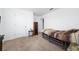 Small bedroom with twin-size bed and carpeted floor at 1606 Steely Dr, Dundee, FL 33838