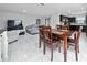 Open concept dining area with kitchen view at 1606 Steely Dr, Dundee, FL 33838
