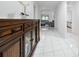 Bright entryway with tile flooring and wooden cabinet at 1606 Steely Dr, Dundee, FL 33838