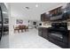 Kitchen with black appliances and granite countertops at 1606 Steely Dr, Dundee, FL 33838