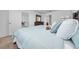 Main bedroom with light blue bedding and dresser at 1606 Steely Dr, Dundee, FL 33838