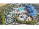 Aerial view of community with pool and amenities at 1607 Kona Ln, Davenport, FL 33897