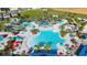 Aerial view of a large community pool with water features at 1607 Kona Ln, Davenport, FL 33897