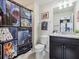 Bathroom with Star Wars themed shower curtain and granite countertop at 1607 Kona Ln, Davenport, FL 33897