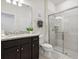 Modern bathroom with granite countertop and large shower at 1607 Kona Ln, Davenport, FL 33897