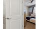 View of a bedroom featuring neutral tones and a bathroom with a glass shower at 1607 Kona Ln, Davenport, FL 33897