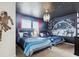 Bedroom with two twin beds, a Star Wars theme, and a decorative lighting fixture at 1607 Kona Ln, Davenport, FL 33897