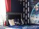Bedroom with Star Wars themed bedding and wall art at 1607 Kona Ln, Davenport, FL 33897