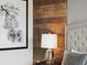 Bedroom detail showing nightstand and accent wall at 1607 Kona Ln, Davenport, FL 33897
