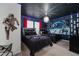 Themed bedroom featuring two beds, blue lighting, and Star Wars wall art creating a playful atmosphere at 1607 Kona Ln, Davenport, FL 33897