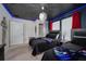 Themed bedroom featuring two beds, blue lighting, and star-themed ceiling creating a whimsical atmosphere at 1607 Kona Ln, Davenport, FL 33897