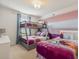 Bedroom with a bunk bed, a full size bed, and a Frozen theme at 1607 Kona Ln, Davenport, FL 33897