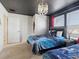 Star Wars themed bedroom with twin beds, a star ceiling, and ample closet space at 1607 Kona Ln, Davenport, FL 33897