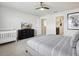 Bedroom with a full size bed, crib, and a dresser with a television on it at 1607 Kona Ln, Davenport, FL 33897