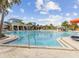 Resort-style community pool with lounge chairs and umbrellas at 1607 Kona Ln, Davenport, FL 33897