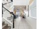 Bright and airy entryway with tiled floor and view of living room at 1607 Kona Ln, Davenport, FL 33897