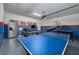 A large game room with ping pong, pool table, basketball, and wall decor for a home's entertainment space at 1607 Kona Ln, Davenport, FL 33897