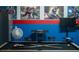 Fun game room with a pool table and colorful Marvel themed wall art at 1607 Kona Ln, Davenport, FL 33897