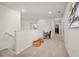 Upstairs hallway with carpet, leading to bedrooms, and featuring a small seating area at 1607 Kona Ln, Davenport, FL 33897