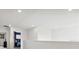 Upstairs hallway with doors to bedrooms and a loft area at 1607 Kona Ln, Davenport, FL 33897