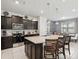 Stylish kitchen boasts stainless steel appliances, granite counters, and a center island at 1607 Kona Ln, Davenport, FL 33897