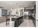 Modern kitchen with stainless steel appliances, granite countertops, and a large center island at 1607 Kona Ln, Davenport, FL 33897