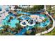 Aerial view of a relaxing lazy river and water slides at 1607 Kona Ln, Davenport, FL 33897