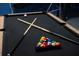 Close up of pool table with colorful billiards and cues at 1607 Kona Ln, Davenport, FL 33897