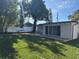 Home exterior showcasing a deck and grassy backyard at 2009 S Osceola Ave, Orlando, FL 32806