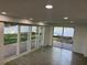 Finished basement with multiple sliding glass doors leading to a deck at 2009 S Osceola Ave, Orlando, FL 32806