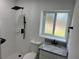 Modern bathroom featuring a walk-in shower with black fixtures and tiled walls at 2009 S Osceola Ave, Orlando, FL 32806
