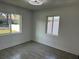 Spacious bedroom with large windows and neutral color palette at 2009 S Osceola Ave, Orlando, FL 32806
