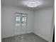 An empty bedroom with French doors overlooking a spacious back yard at 2009 S Osceola Ave, Orlando, FL 32806