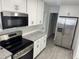 Updated kitchen boasts stainless steel appliances and ample cabinet space at 2009 S Osceola Ave, Orlando, FL 32806