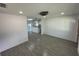 Open concept living and kitchen area with gray tile floors at 2009 S Osceola Ave, Orlando, FL 32806