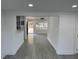 Open living area with gray tile floors and view to kitchen at 2009 S Osceola Ave, Orlando, FL 32806