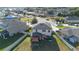 Aerial view of the backyard featuring a playground, patio with shade, and fenced perimeter at 2211 Bittle Way, St Cloud, FL 34769