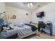 Well-lit bedroom with modern ceiling fan and desk at 2211 Bittle Way, St Cloud, FL 34769
