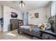 Well lit bedroom with wall mounted TV at 2211 Bittle Way, St Cloud, FL 34769
