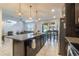 Spacious kitchen with dark cabinetry and granite countertops at 2211 Bittle Way, St Cloud, FL 34769
