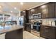 Modern kitchen with stainless steel appliances and granite counters at 2211 Bittle Way, St Cloud, FL 34769